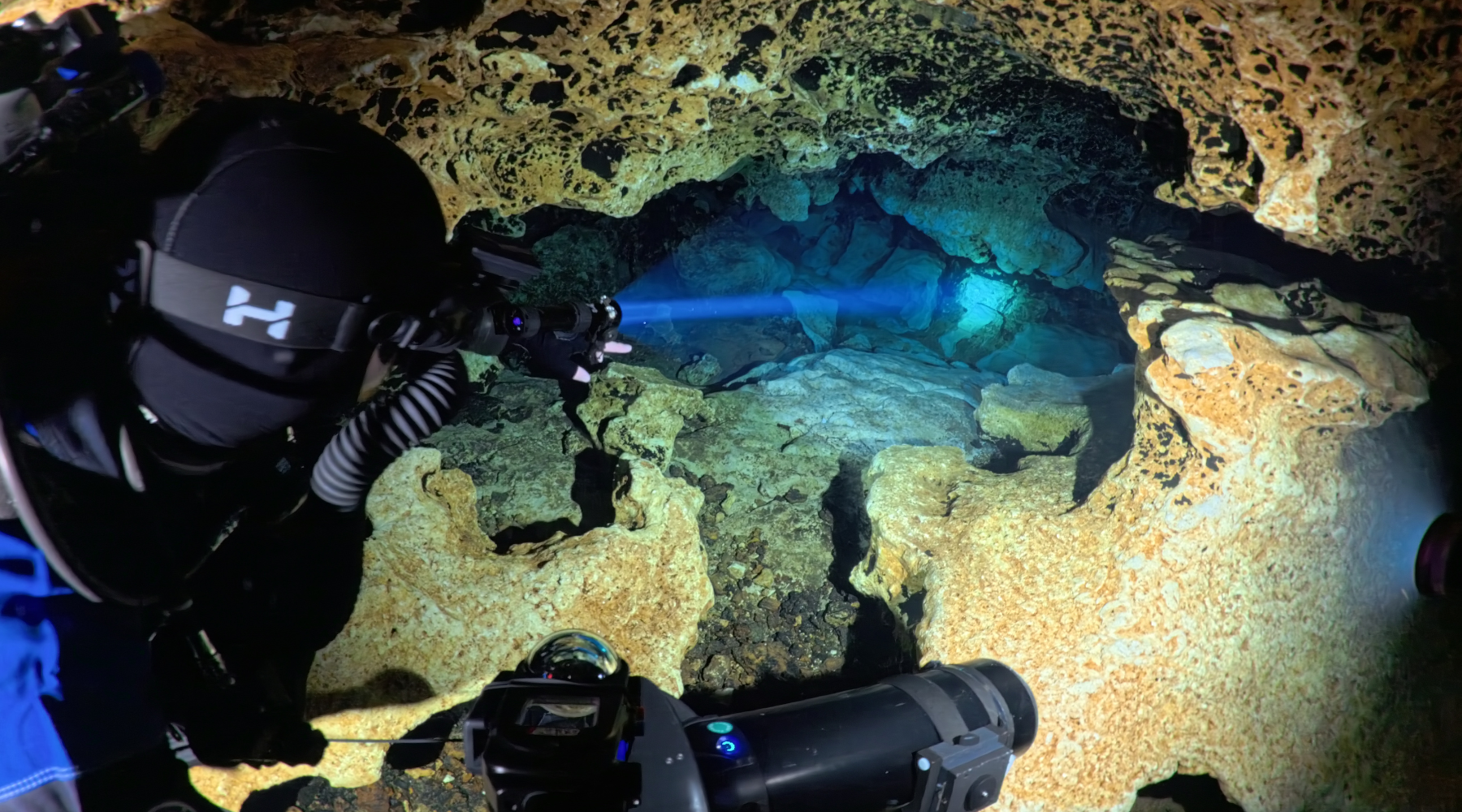 Halcyon Phaser focused beam being used by a diver in an overhead cave environment