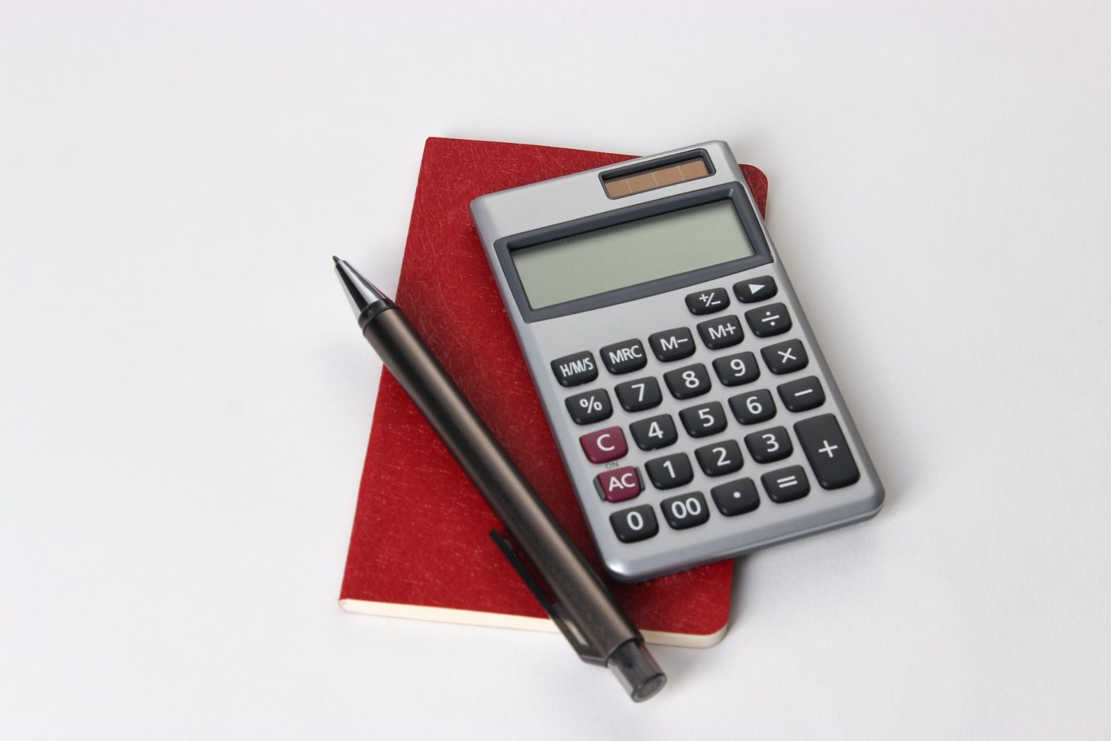 Calculator, notebook and pen