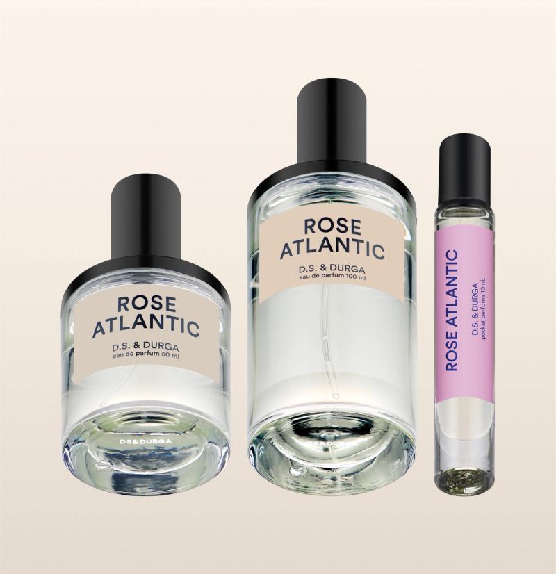 Three sleek bottles of "rose atlantic” eau de parfum by d.s. &amp; durga, showcasing minimalist design and varying sizes.