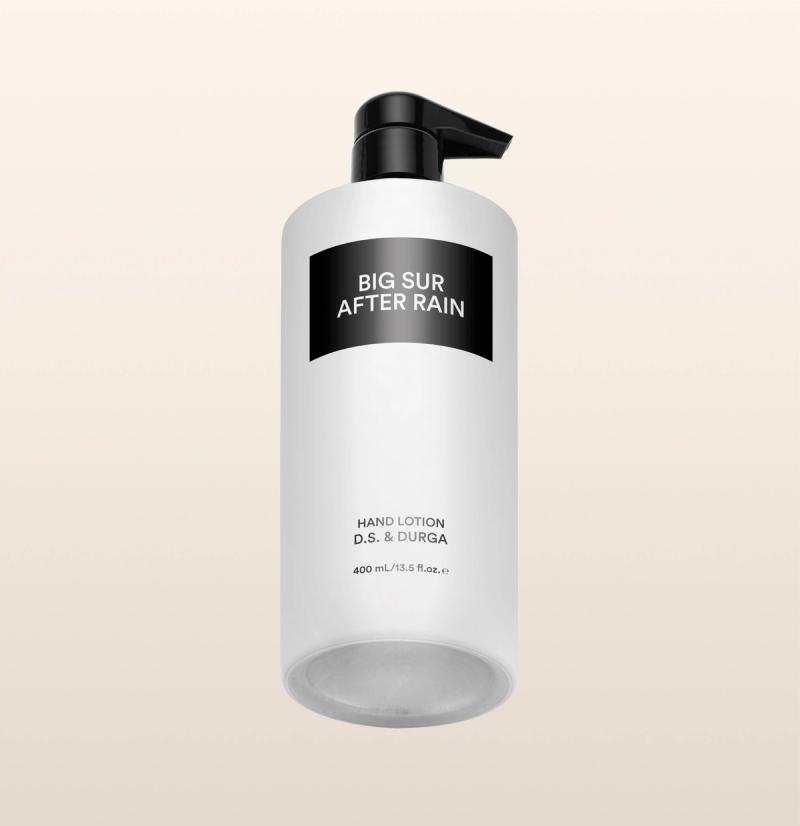 A sleek white bottle of hand lotion with a pump labeled "Big Sur After Rain" by D.S. & Durga on a neutral background.