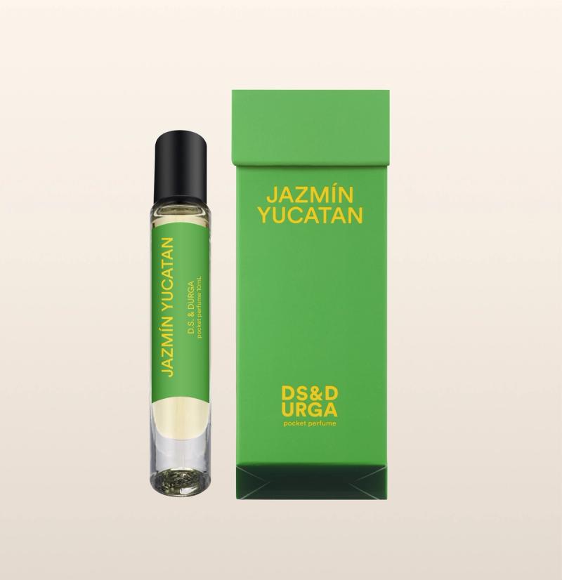 A sleek, roll-on bottle of "jazmin yucatan" perfume oil, next to its minimalist packaging.