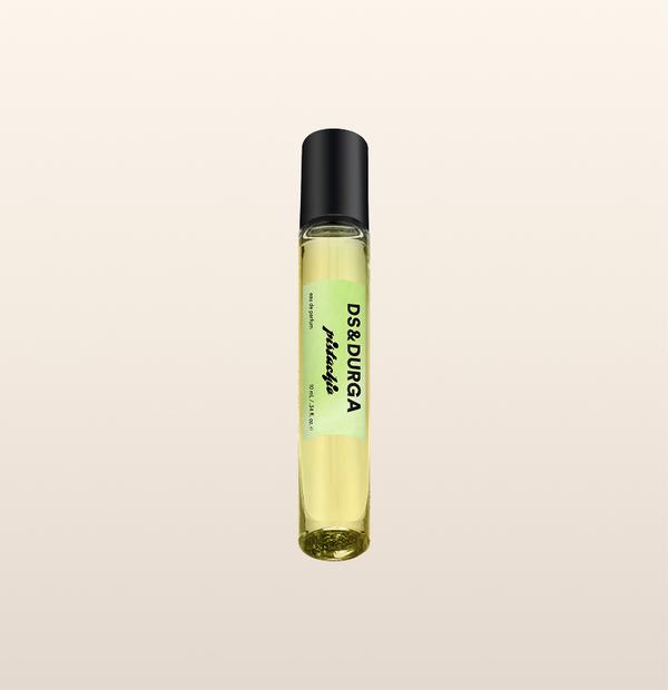 A sleek 10 mL travel size perfume spray bottle labeled “Pistachio” by d.s. & durga, with a black cap and pale green label.