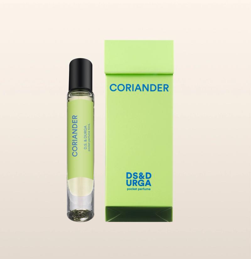 A sleek, roll-on bottle of "coriander" perfume oil, next to its minimalist packaging.