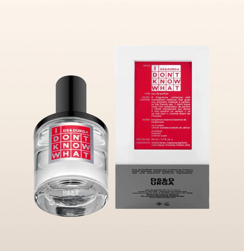 A clear perfume bottle labeled "I DON'T KNOW WHAT" by DS & DURGA is shown next to its box, which features the same red and white label and product details on a light beige background.