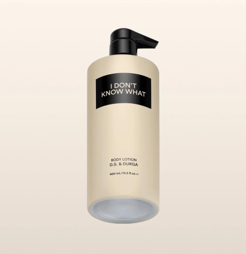 A sleek cream bottle of body lotion with a pump labeled "I Don't Know What" by D.S. & Durga on a neutral background.