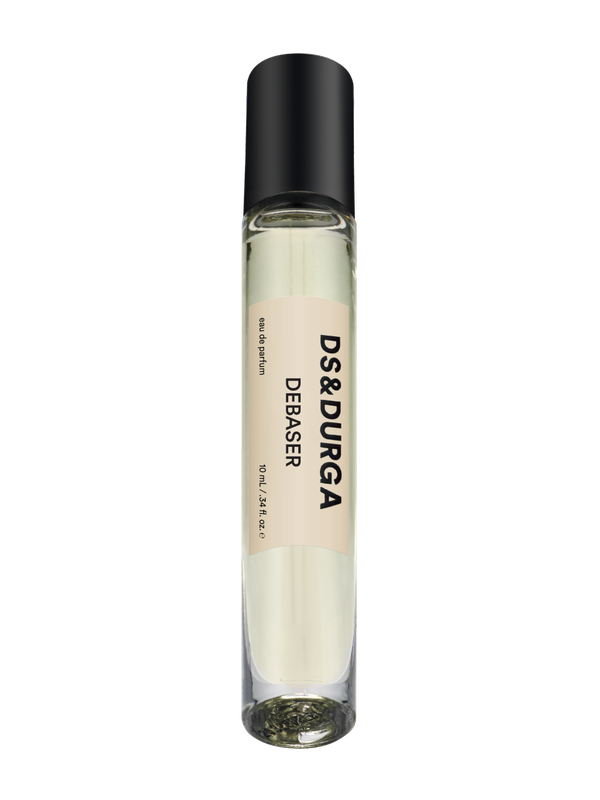 A sleek 10 mL travel size perfume spray bottle labeled “Debaser” by d.s. & durga, with a black cap and cream label.