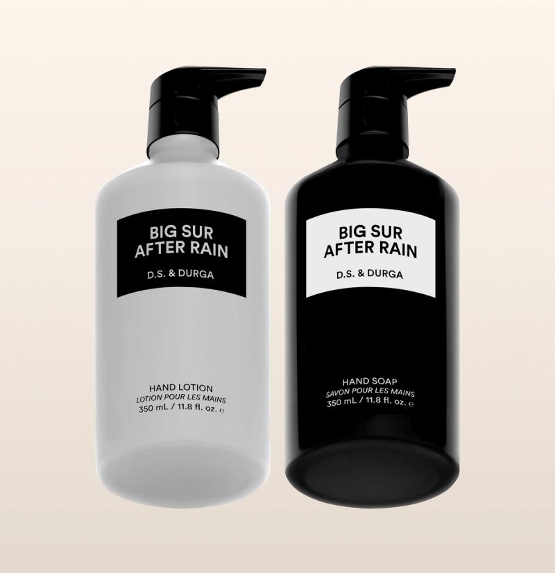 Two aluminum bottles labeled "Big Sur After Rain" by D.S. & Durga, one hand soap and one hand lotion against a neutral background. 