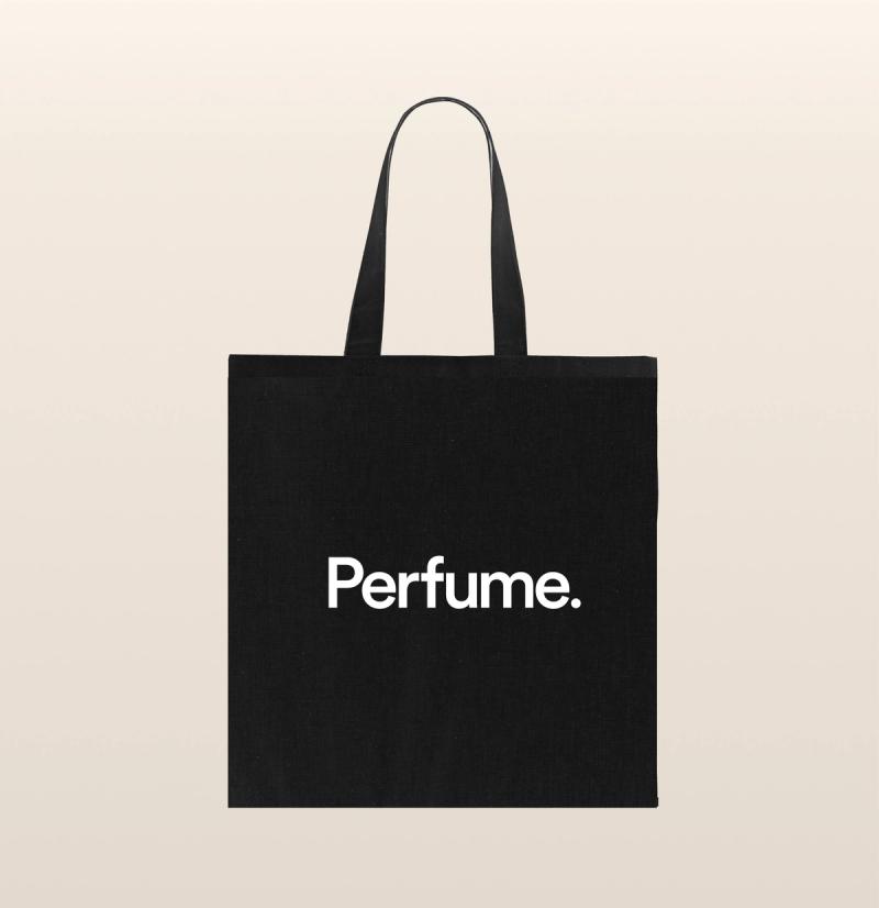 A black tote bag with the word "perfume" written in white font.