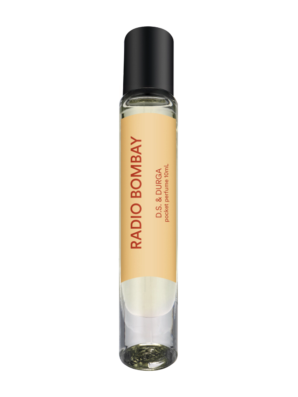 A sleek rollerball perfume bottle with a yellow label that reads "radio bombay" by d.s. &amp; durga. 