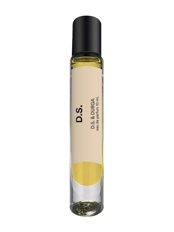 A sleek glass perfume bottle with a black cap, labeled "d.s." in bold lettering.