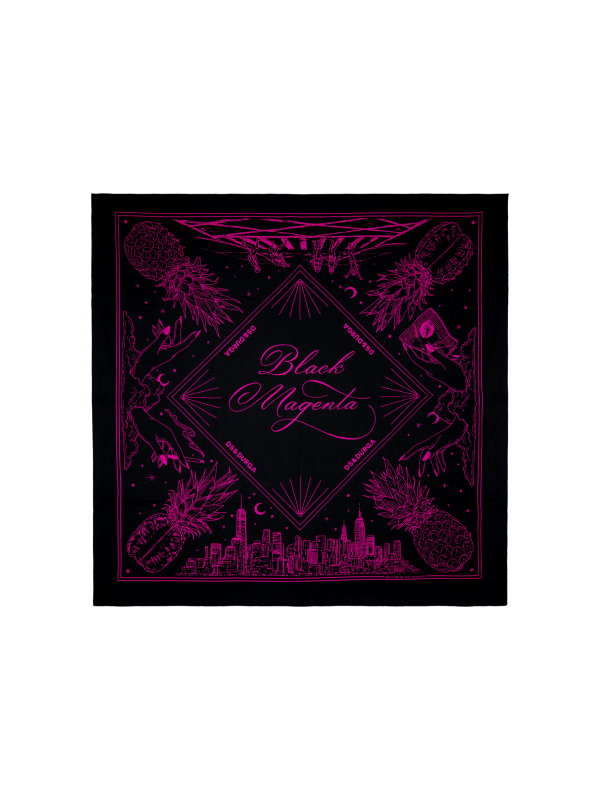 A neon magenta illustration on square black cloth featuring symmetrical designs with pineapples, tropical leaves, and urban skyscrapers, centered around a diamond shape containing the text "black magenta"