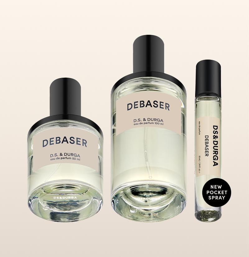 Three sleek bottles of "debaser” eau de parfum by d.s. & durga, in varying sizes.