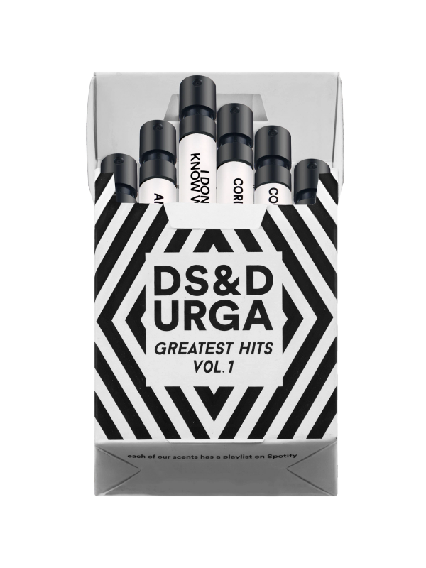 A collection of perfume bottles in a black and white striped bold packaging with the text "ds&amp;durga greatest hits vol. 1" and a footnote indicating that each scent has a playlist on spotify.