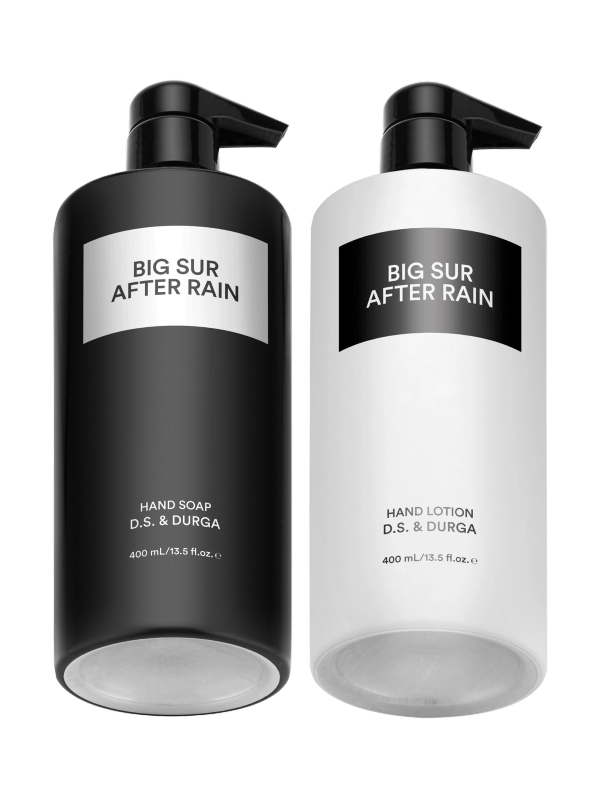 Two aluminum bottles labeled "Big Sur After Rain" by D.S. & Durga, one hand soap and one hand lotion.