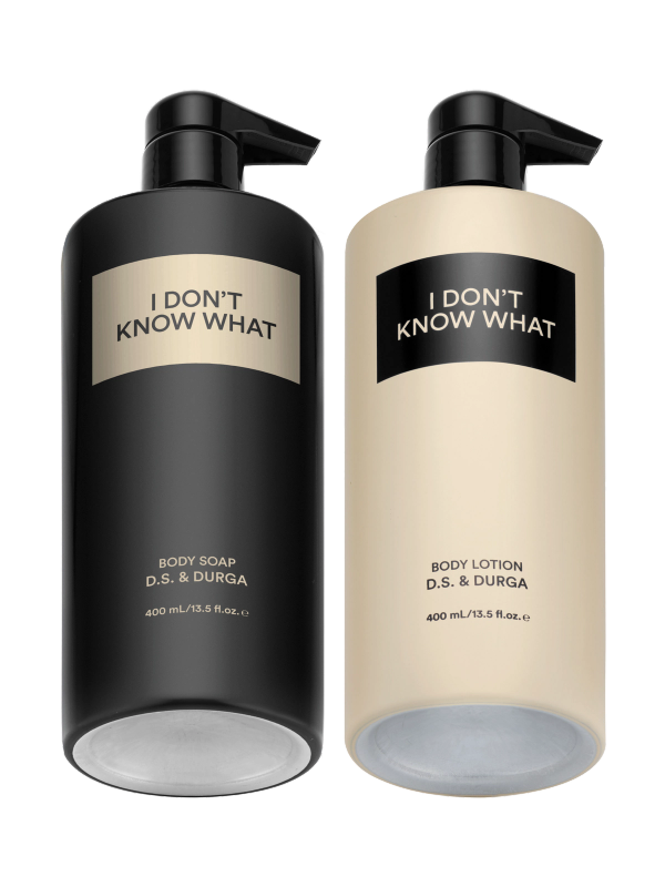Two aluminum bottles labeled "I Don't Know What" by D.S. & Durga, one body soap and one body lotion.