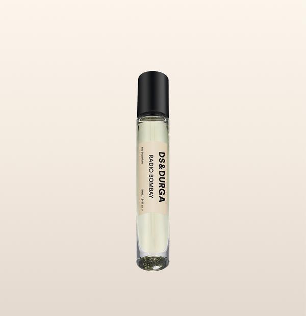 A sleek 10 mL travel size perfume spray bottle labeled “Radio Bombay” by d.s. & durga, with a black cap and cream label.
