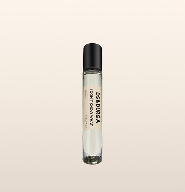 A sleek 10 mL travel size perfume spray bottle labeled “I Don’t Know What” by d.s. & durga, with a black cap and cream label.