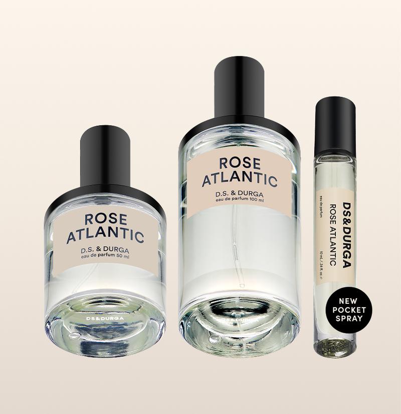 Three sleek bottles of "rose atlantic” eau de parfum by d.s. & durga, showcasing minimalist design and varying sizes.