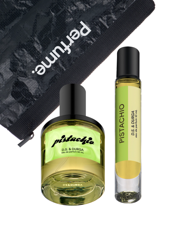 Two elegantly designed bottles of "pistachio" perfume from d.s. &amp; durga, placed against a black background with a partially visible branded packaging pouch.