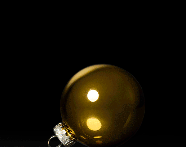 black hammer with stop motion image of a gold hammer smashing a gold spherical holiday ornament