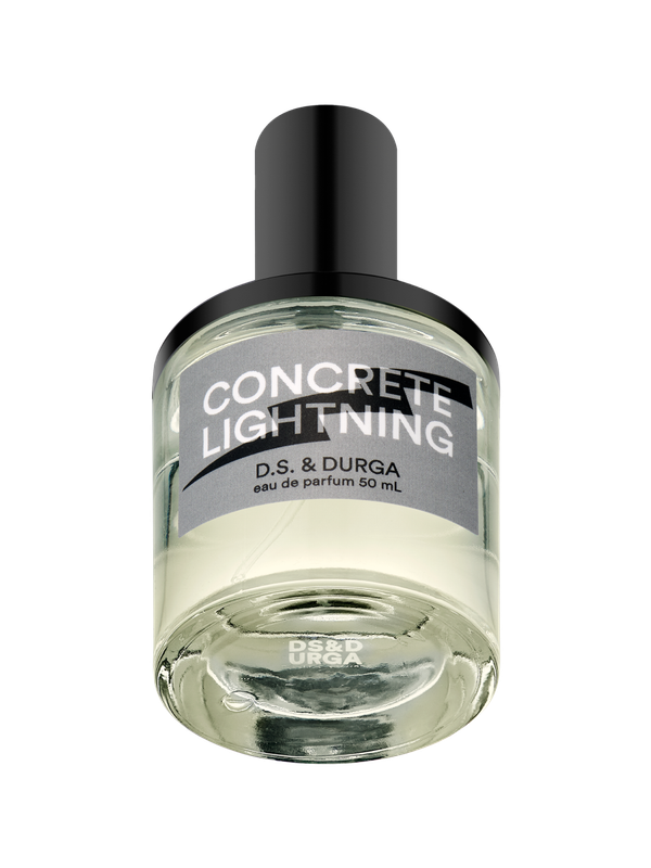 A clear glass bottle of perfume labeled "CONCRETE LIGHTNING" by D.S. & DURGA, with a black cap and gray label, containing 50 mL of eau de parfum.
