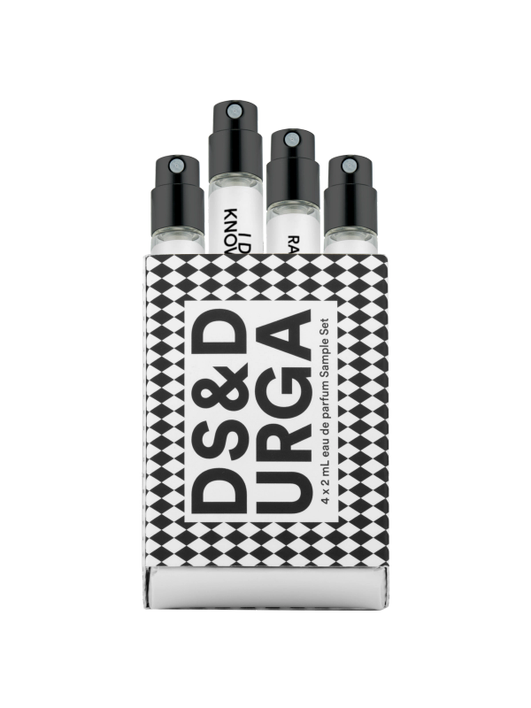 A set of four small perfume spray vials in a black-and-white checkered box labeled "DS&DURGA 4 x 2 ml Eau de Parfum Sample Set"