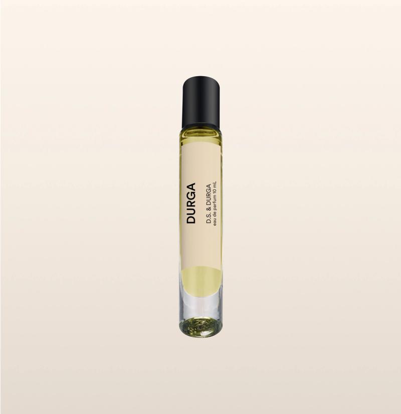 A sleek glass perfume bottle with a black cap, labeled "durga" in bold lettering. 
