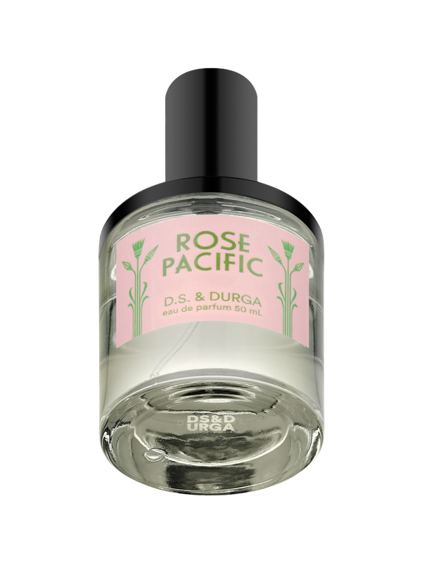 A sleek glass bottle of “Rose Pacific” eau de parfum by D.S. & DURGA, 50 mL, with a pink label and black cap.