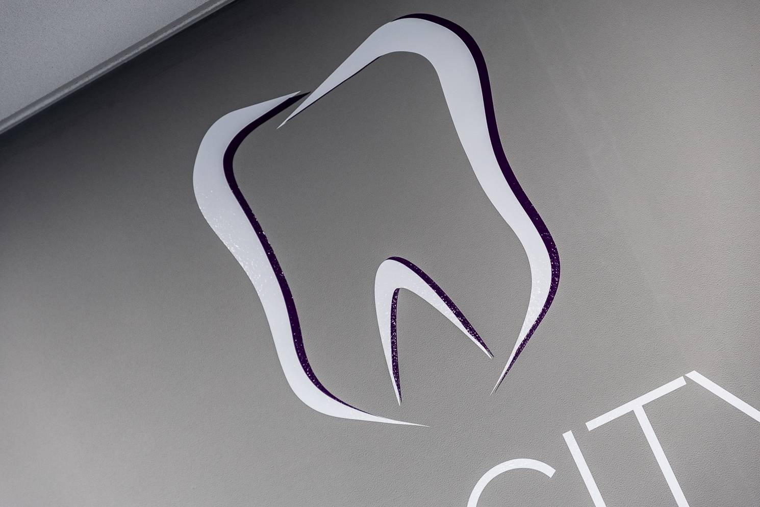 Plymouth City Centre Dental Practice logo representing a stylistic tooth