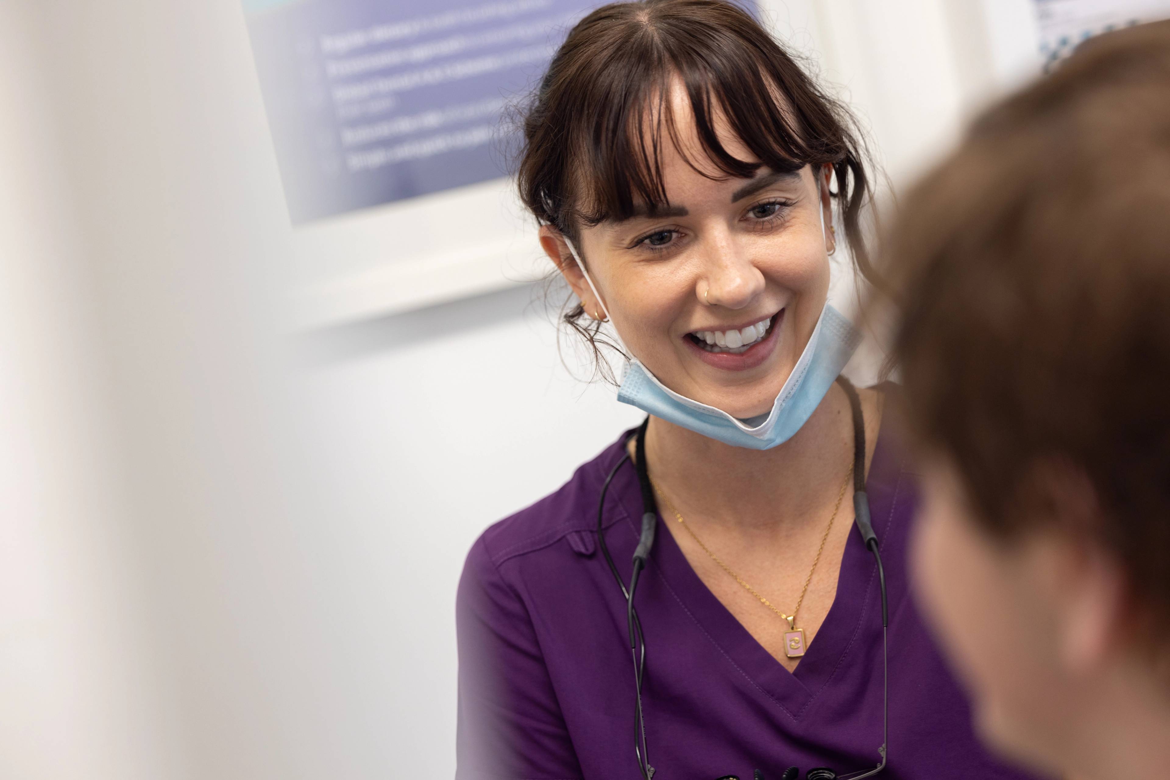 Dental therapist Lucy Steward speaks to a patient