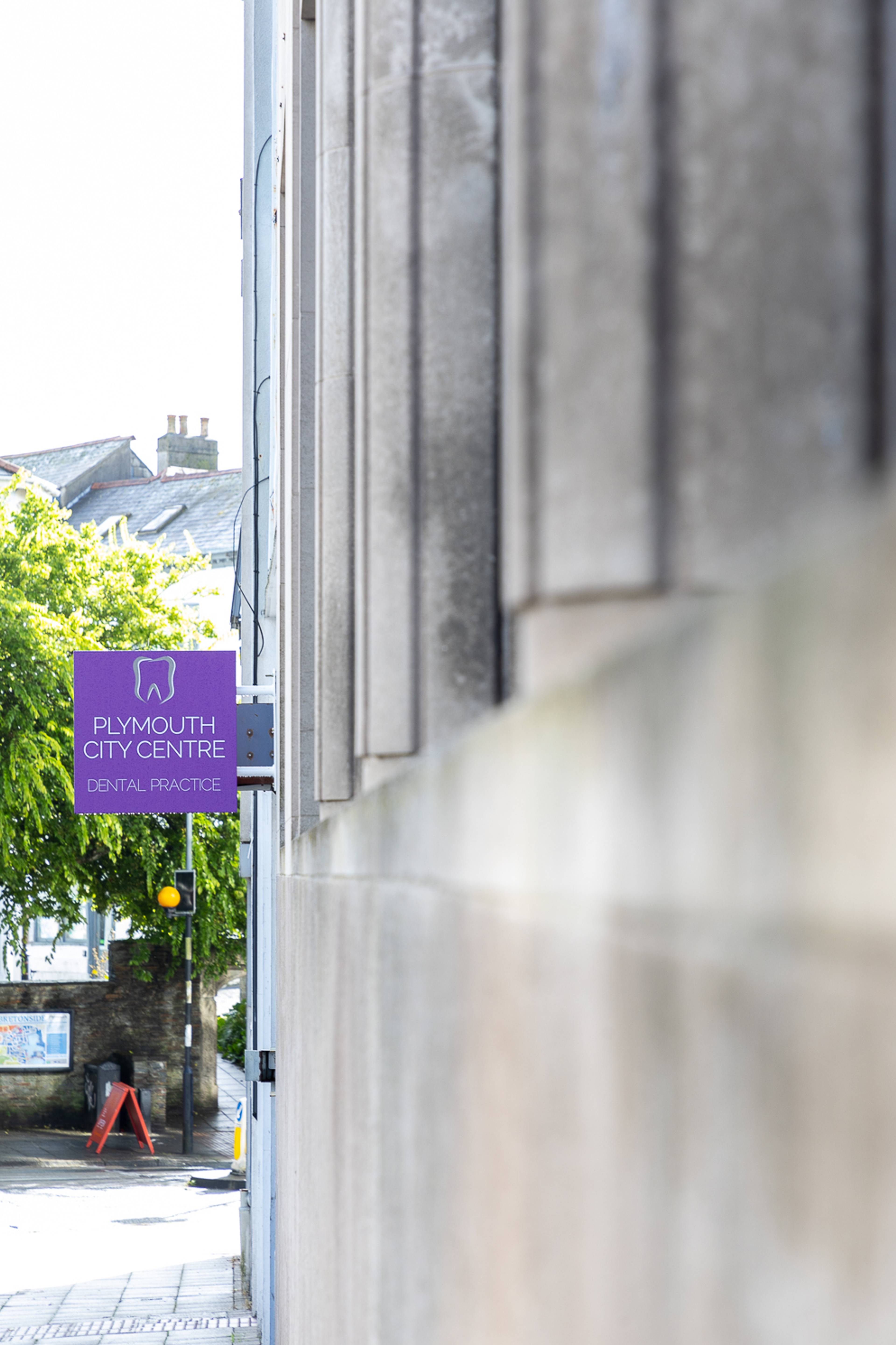 Plymouth City Centre Dental Practice signage on the side of the building 