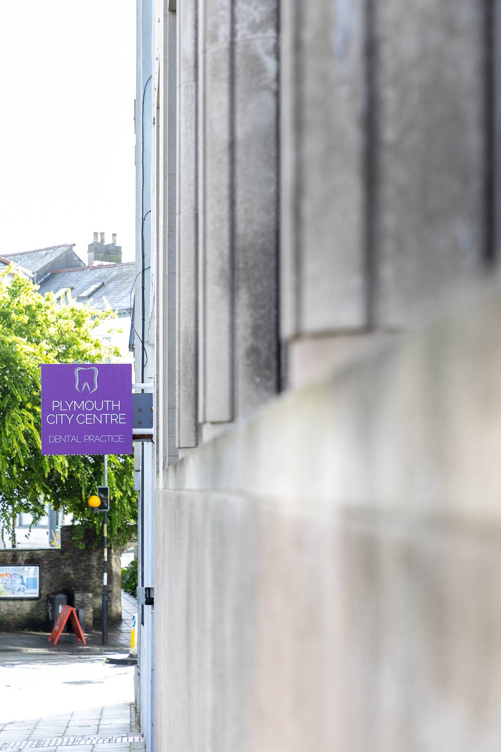 Plymouth City Centre Dental Practice signage on the side of the building
