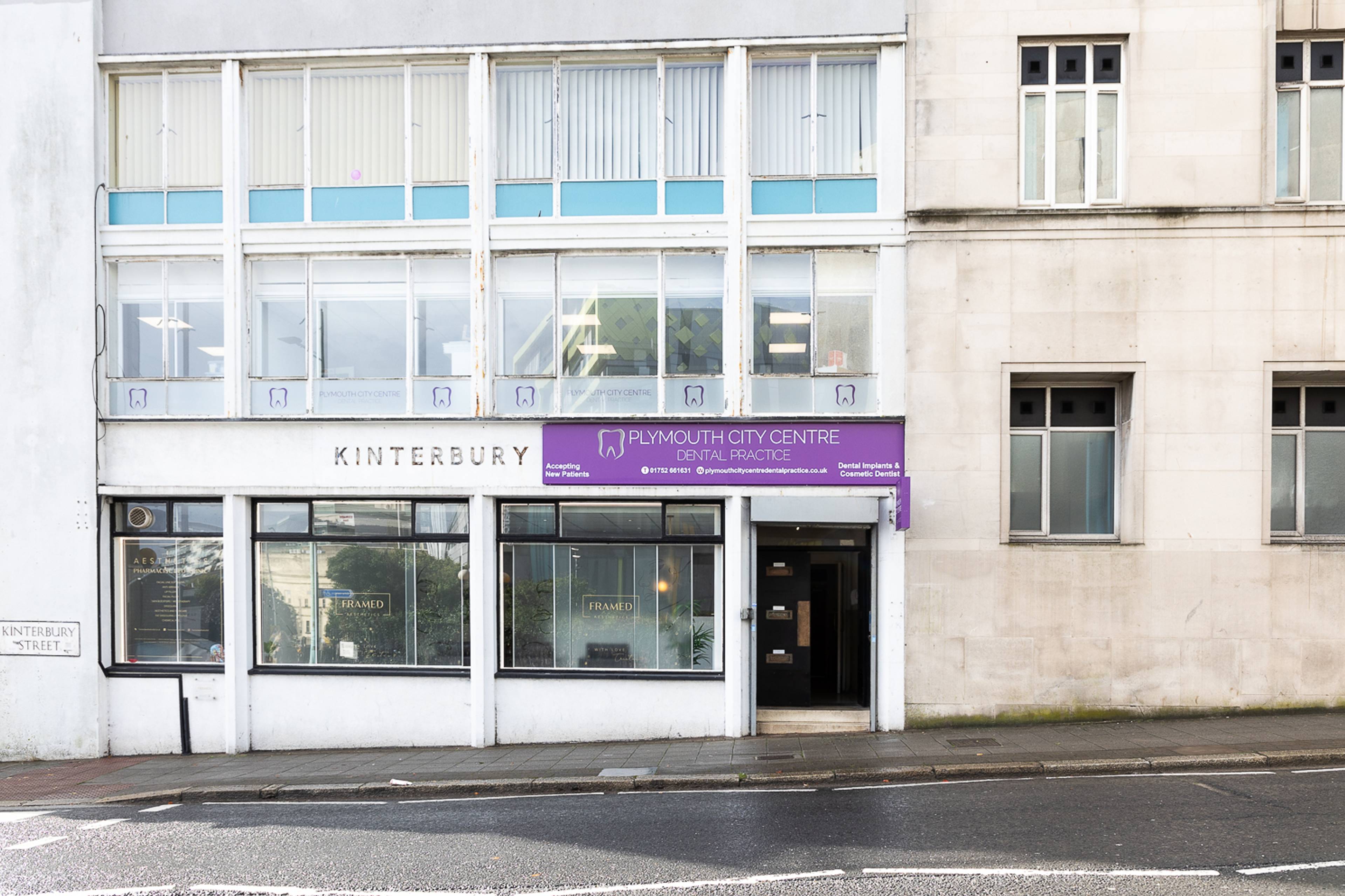Kinterbury house with a sign for Plymouth City Centre Dental Practice