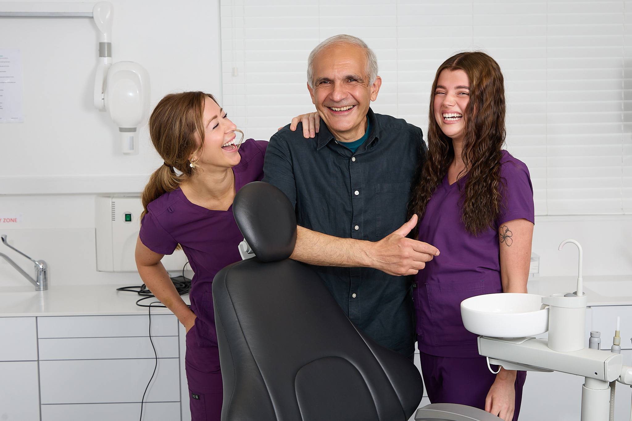 Shahriar Majlessi and two of our dental nurses laughing in a treatment room
