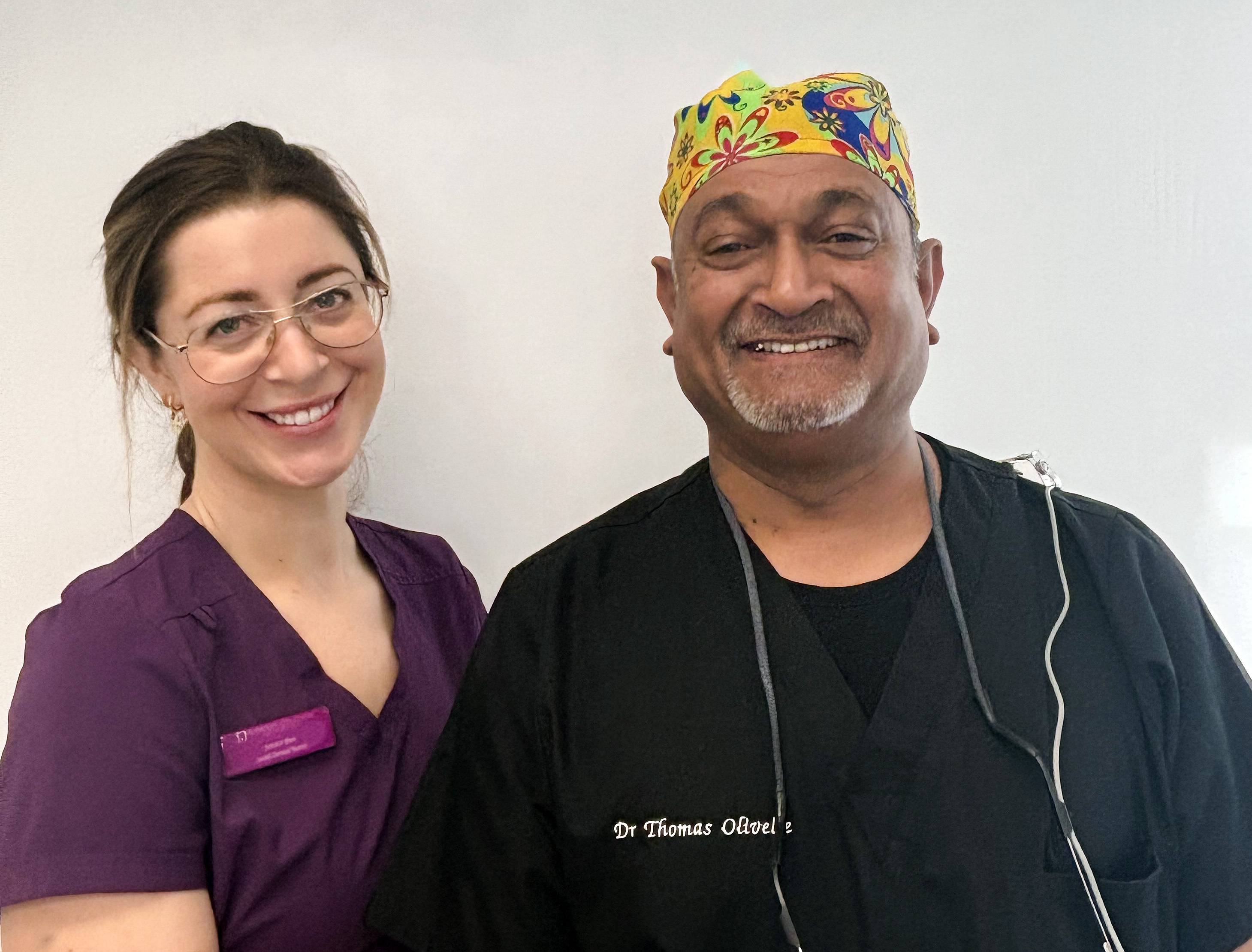 Tom Olivelle and his dental nurse smiling together