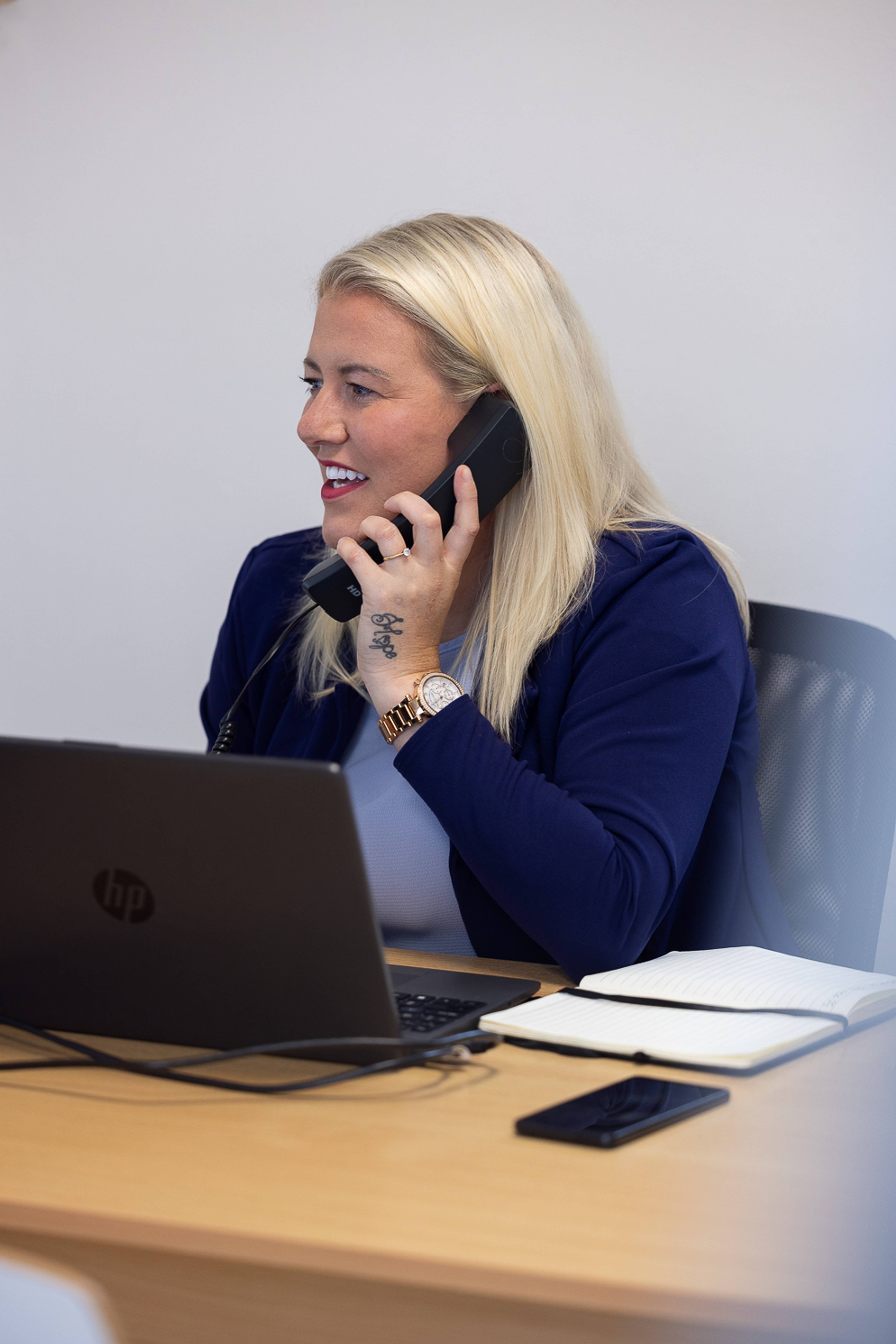 Practice Manager Sophie Burrows on the phone with a patient