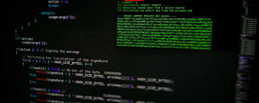 A laptop screen displaying ominous looking code