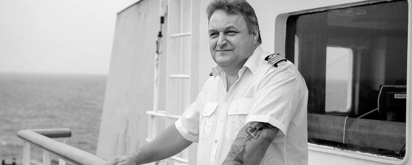 A captain on the bridge of his vessel