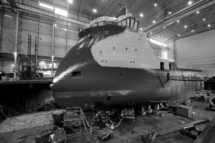 A service vessel under construction in a shipyard