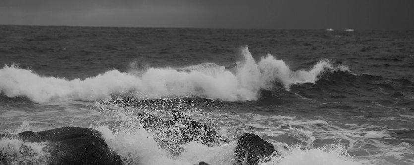 Waves crash on to a rocky shore