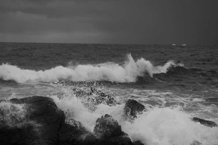 A rocky coastline is pounded by waves