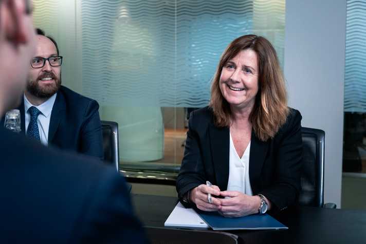 Underwriters in the Bergen office hold a meeting
