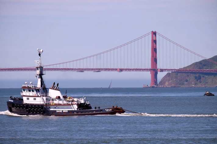 A tug boat at work