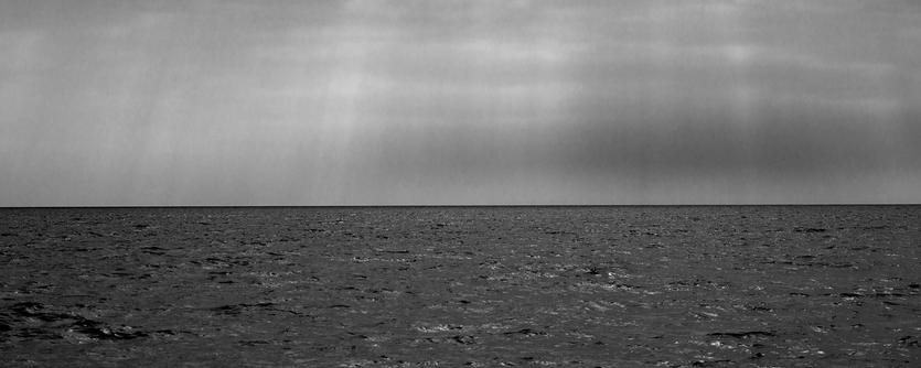 Calms seas below a moody sky