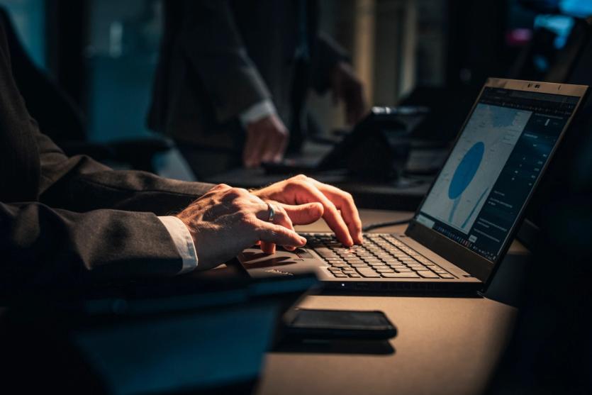 Someone using a laptop at the office