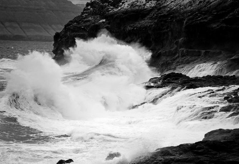 Waves pound a dramatic shoreline