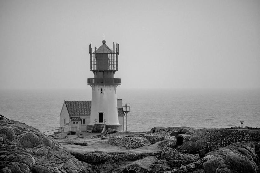 A lighthouse on a rocky coastline