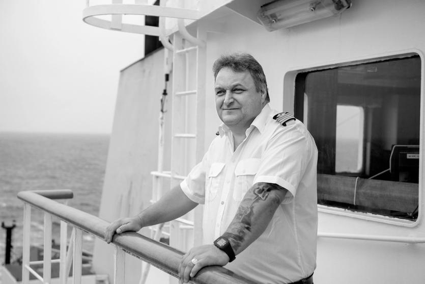A captain on the bridge of his vessel