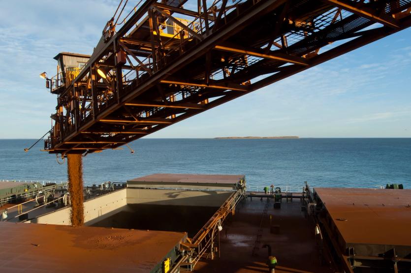 Loading a ship's hold with iron ore