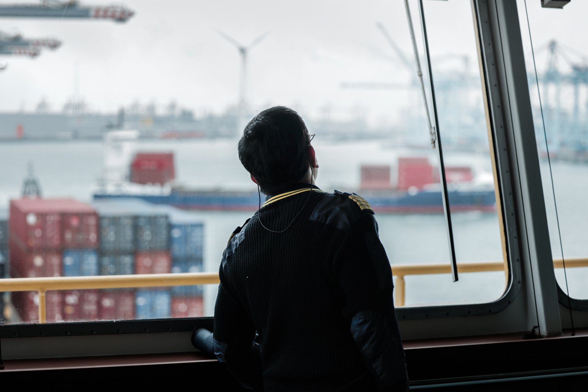 A captain on the bridge of a ship